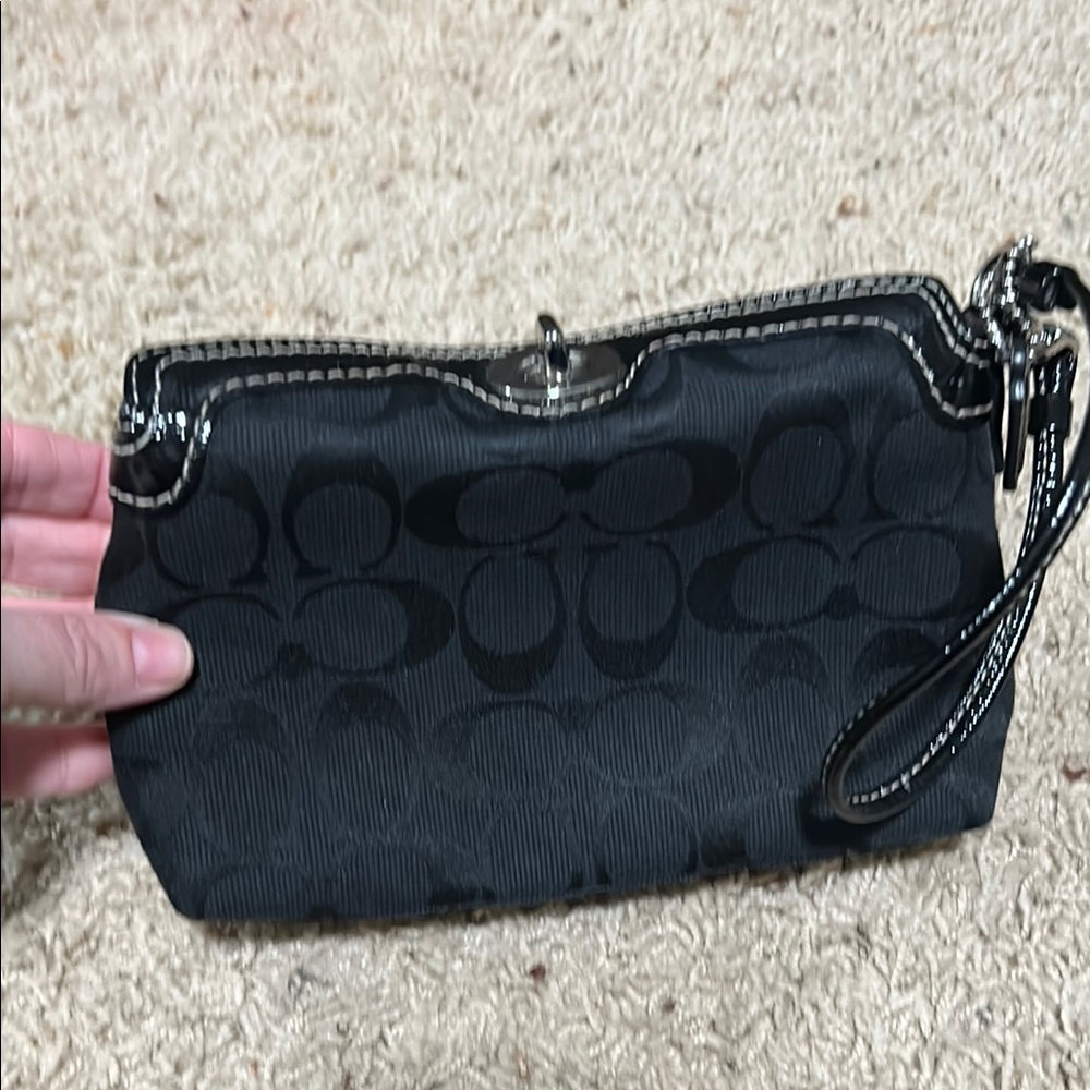 Black Coach Women's turn lock wristlet